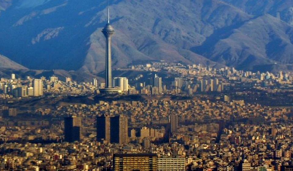 City building in Iran in front of mountains