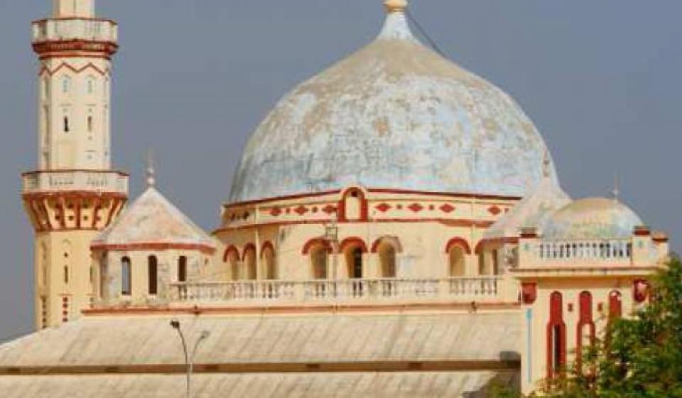 Beige Grande mosque of Diourbel with red trim