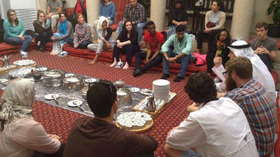 Group of diverse people with food in the middle